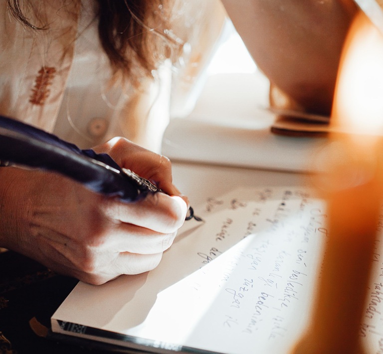 Author writing down ideas for a book